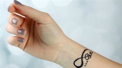 تفسير حلم الوشم في المنام.. وما علاقة ذلك بالحسد؟