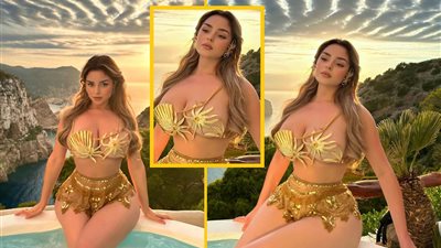 عارضة الأزياء ثنائية الجنس ديمي روز بإطلالة مثيرة بالبكيني الذهبي (صور)  